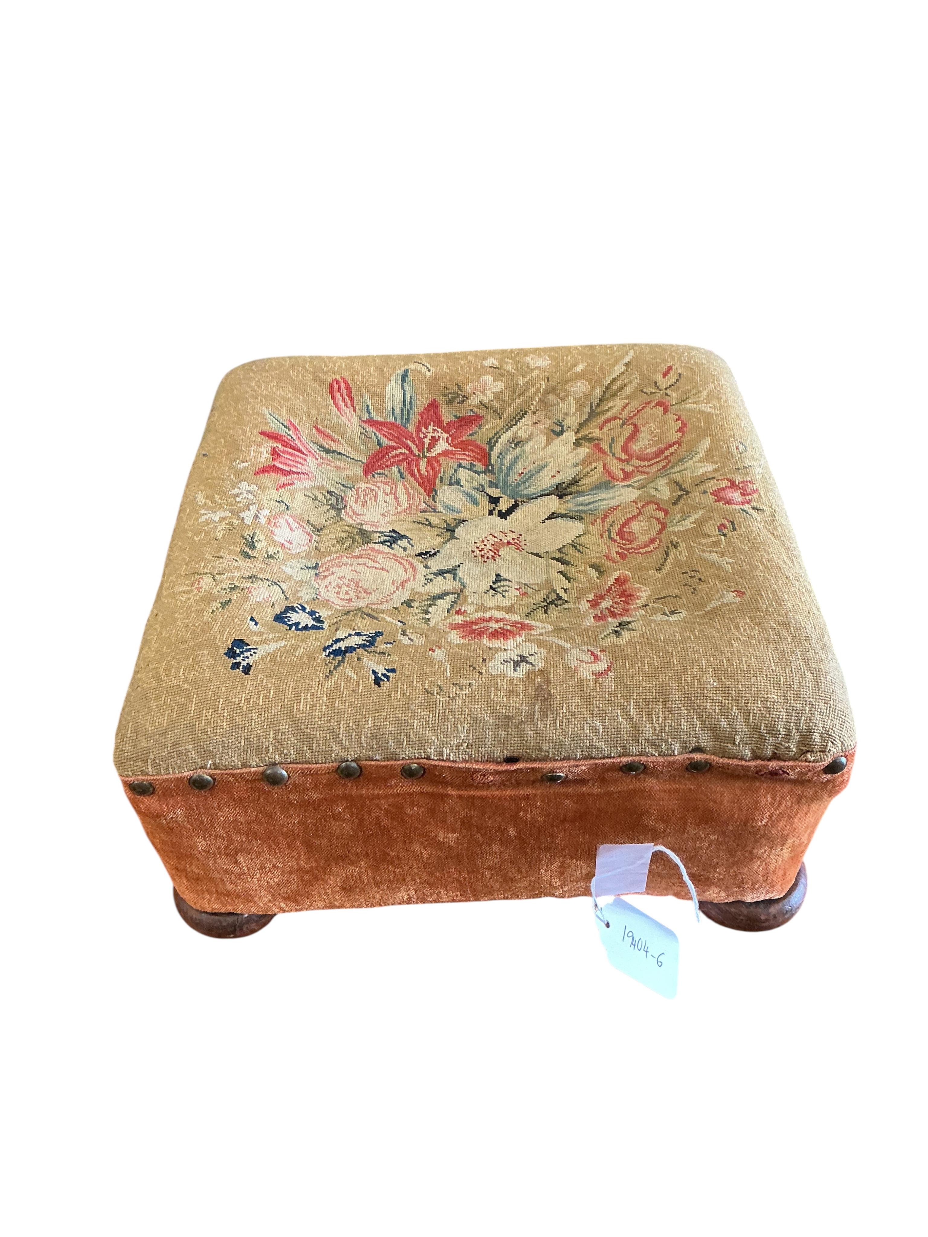 Two Victorian floral tapestry footstools, larger diameter 38cm